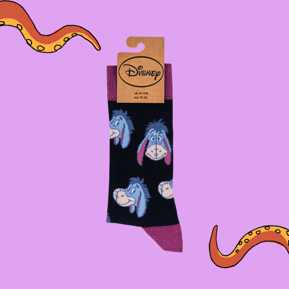 
                      
                        A pair of socks depicting eeyore. Black legs, pink heel, toe and cuff. 
                      
                    