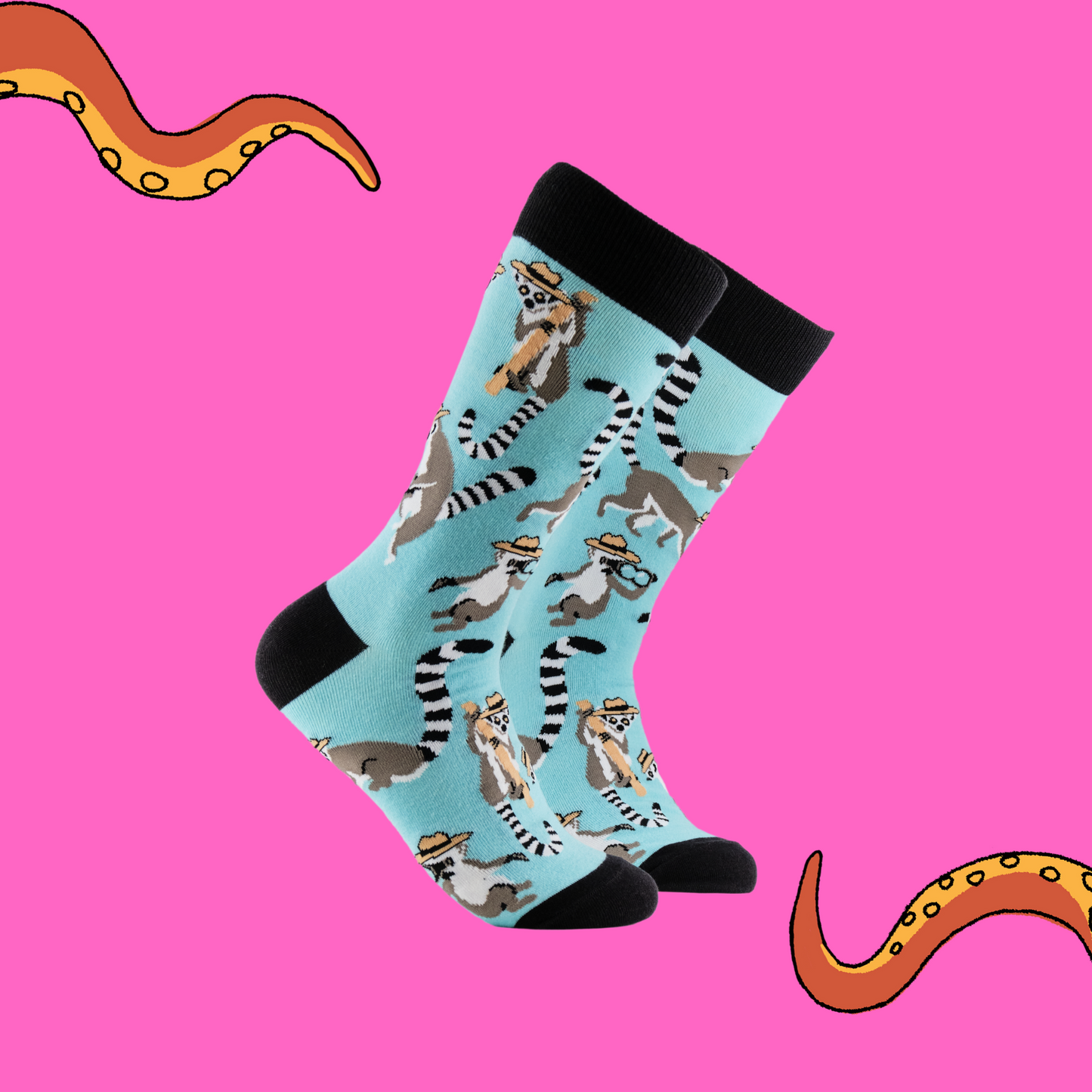 A pair of socks depicting Lemurs being detectives. Light blue legs, black cuff, heel and toe.