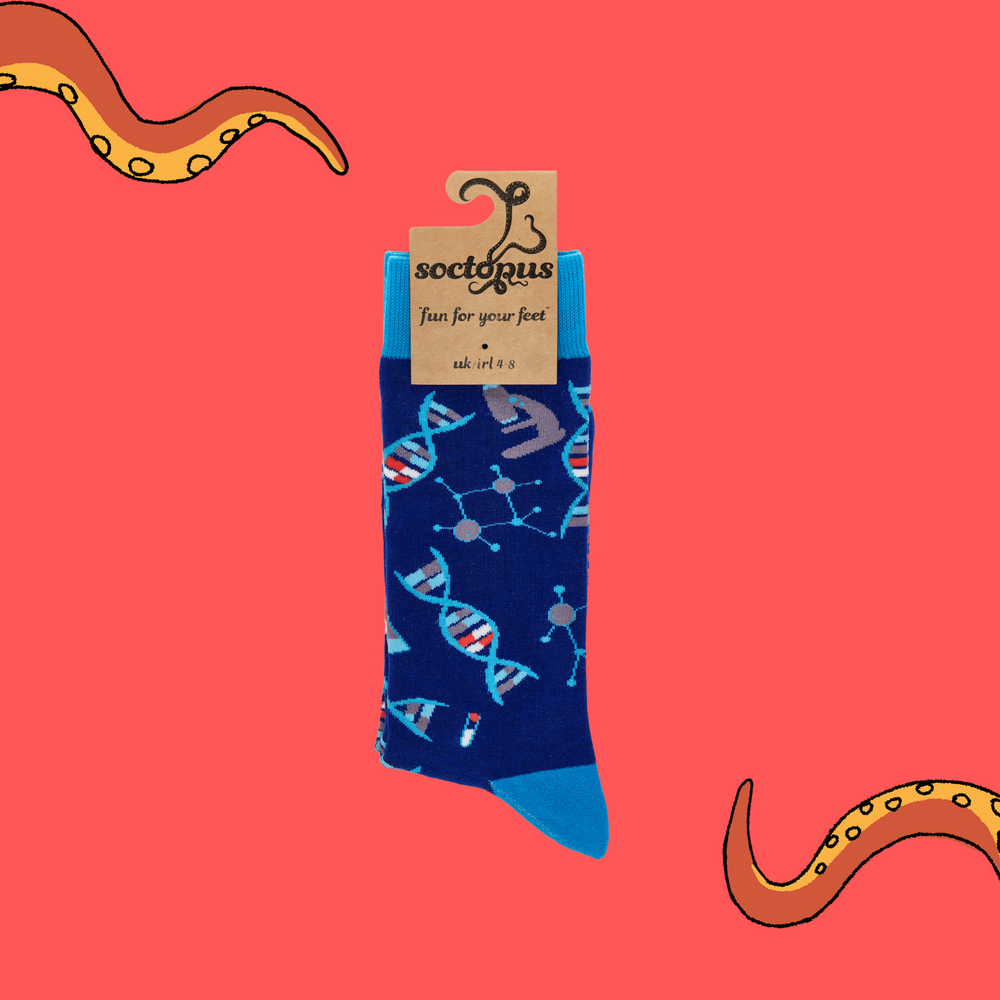 
                      
                        A pair of socks depicting DNA and microscopes. Blue legs, light blue cuff, heel and toe. In Soctopus Packaging.
                      
                    