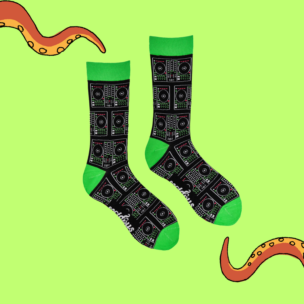 
                      
                        A pair of socks depicting digital DJ controllers. Black legs, green cuff, heel and toe.
                      
                    