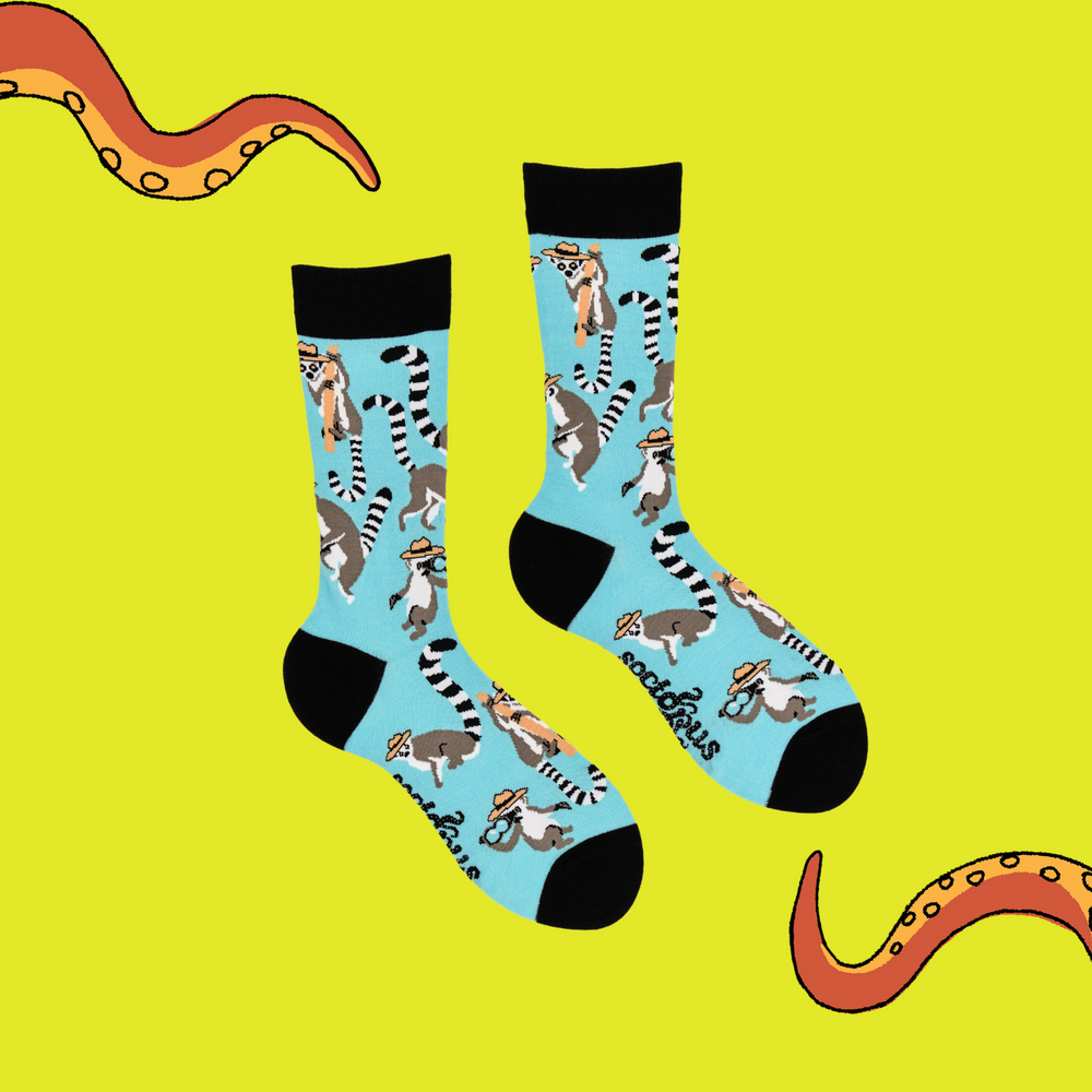 
                      
                        A pair of socks depicting Lemurs being detectives. Black legs, light blue cuff, heel and toe.
                      
                    