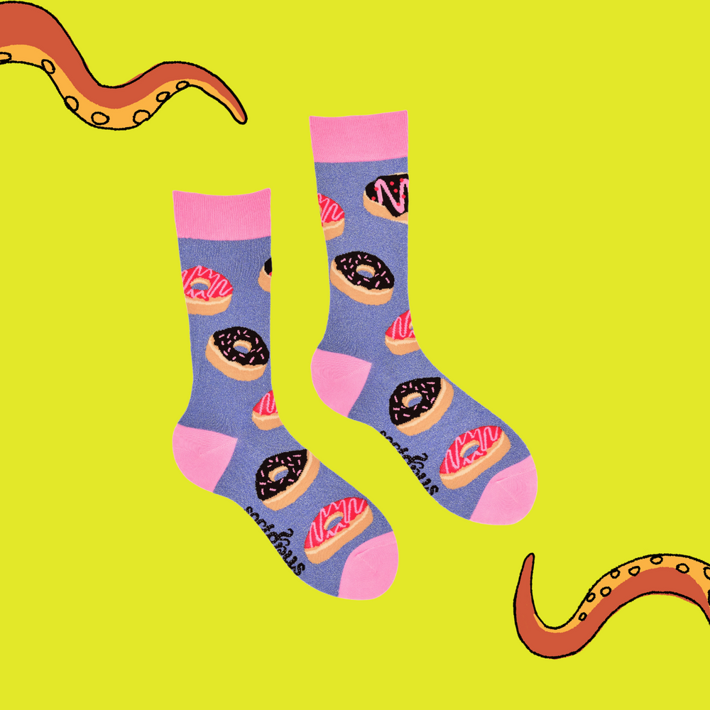 
                      
                        A pair of socks depicting iced doughnuts. Light purple legs, pink cuff, heel and toe.
                      
                    