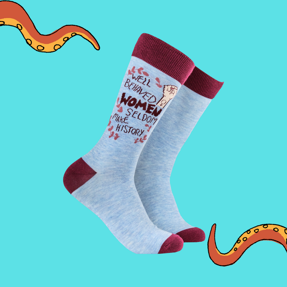 A pair of socks with a feminist slogan. Blue legs, claret heel, toe and cuff. 