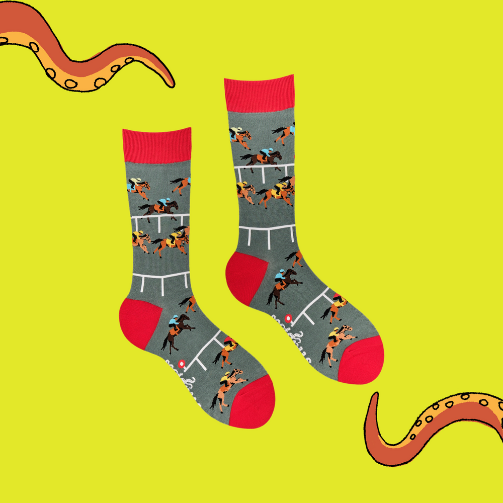 
                  
                    A pair of socks depicting horse racing. Grey legs, red cuff and, heel and toe.
                  
                