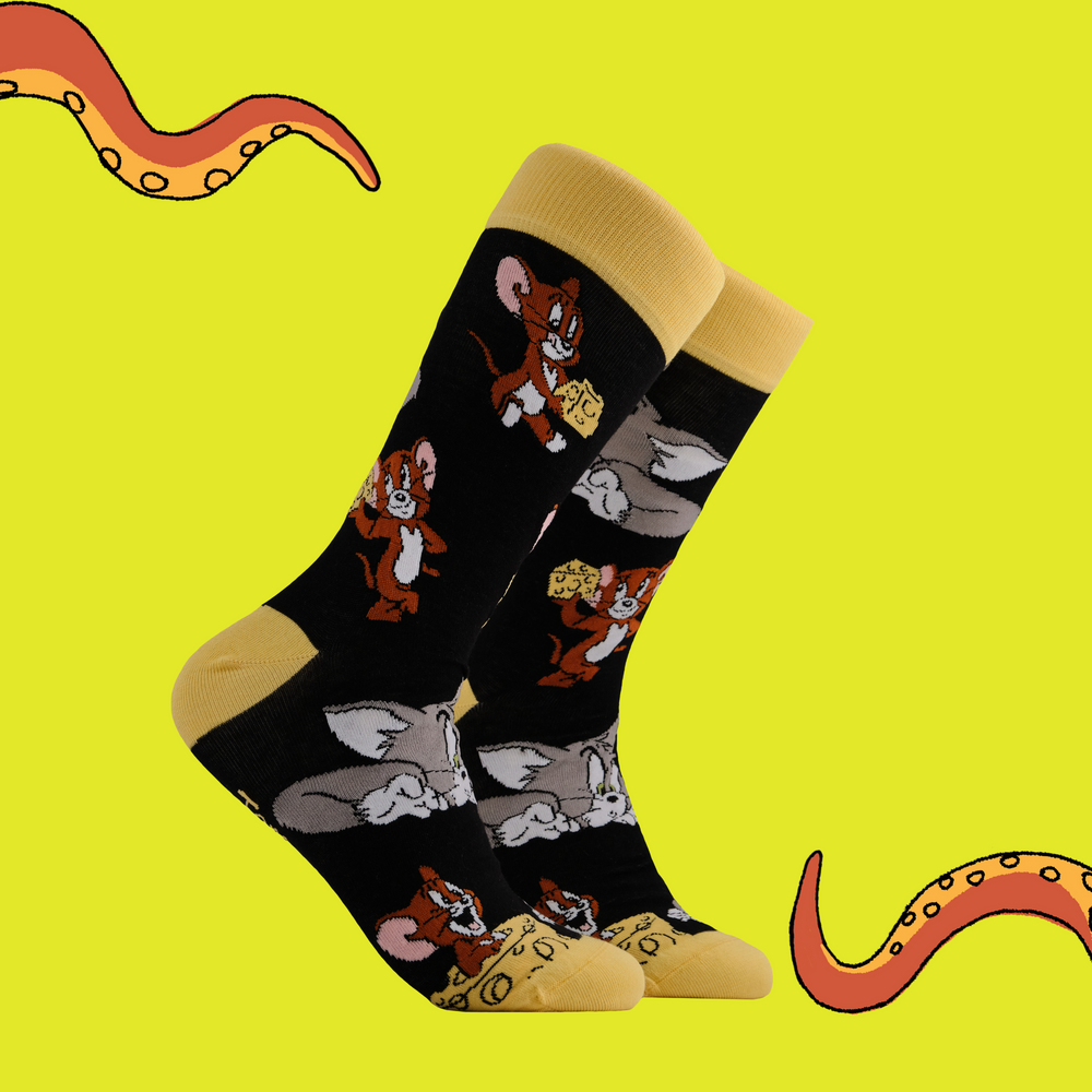 A pair of socks depicting the lovable duo of Tom and Jerry. Black legs, yellow toe, cuff and heel.