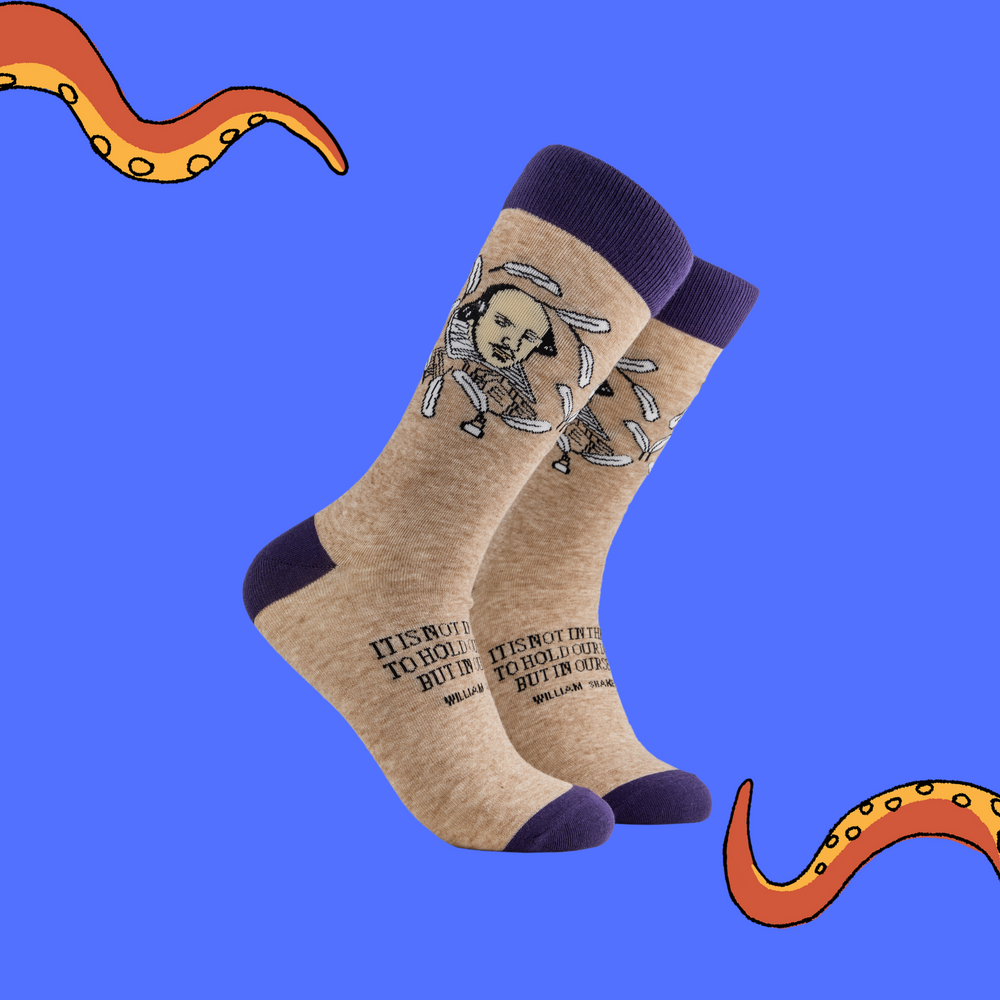 A pair of socks depicting William Shakespeare. Oatmeal legs, purple cuff, heel and toe.