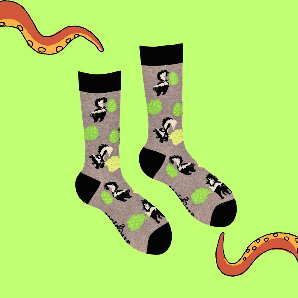 
                      
                        A pair of socks depicting stinky skunks. Grey legs, black cuff, heel and toe.
                      
                    