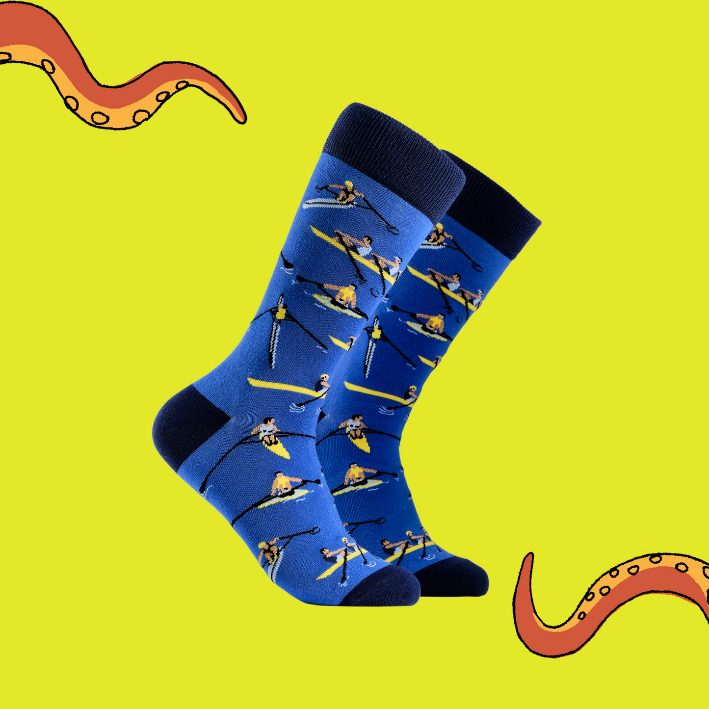 A pair of socks depicting row boat racers. Blue legs, dark blue cuff, heel and toe.