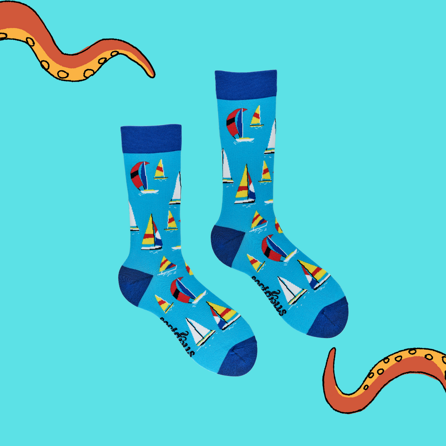 
                  
                    A pair of socks depicting sailing boats. Blue legs, dark cuff, heel and toe.
                  
                