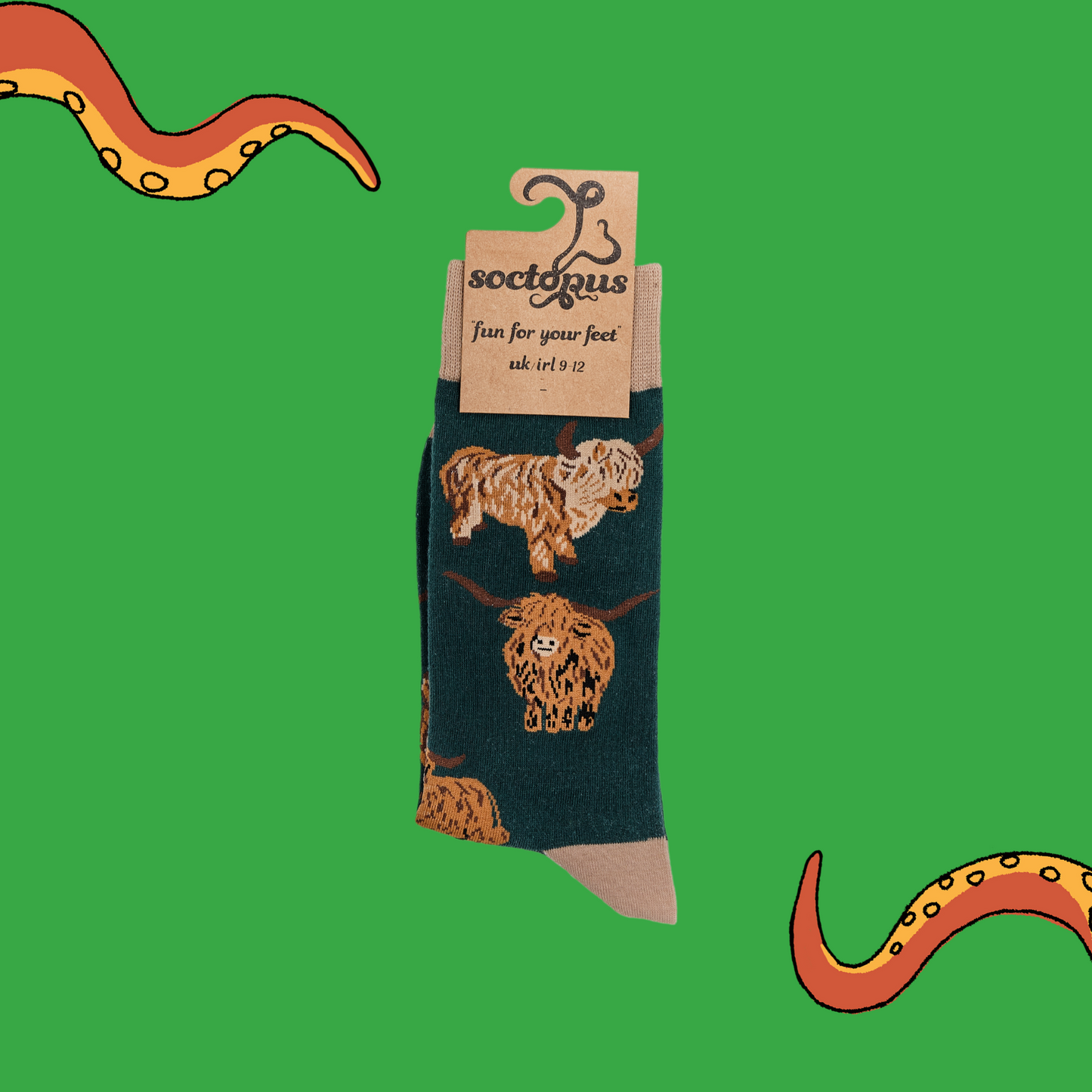 
                  
                    A pair of socks depicting highland cows. Dark green legs, cream cuff, heel and toe. In Soctopus Packaging.
                  
                