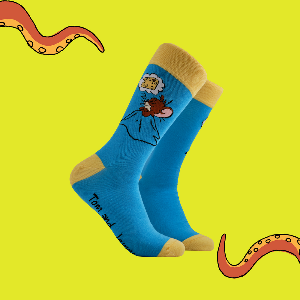 A pair of socks depicting Jerry having cheese dreams. Blue leg, yellow toe, cuff and heel.