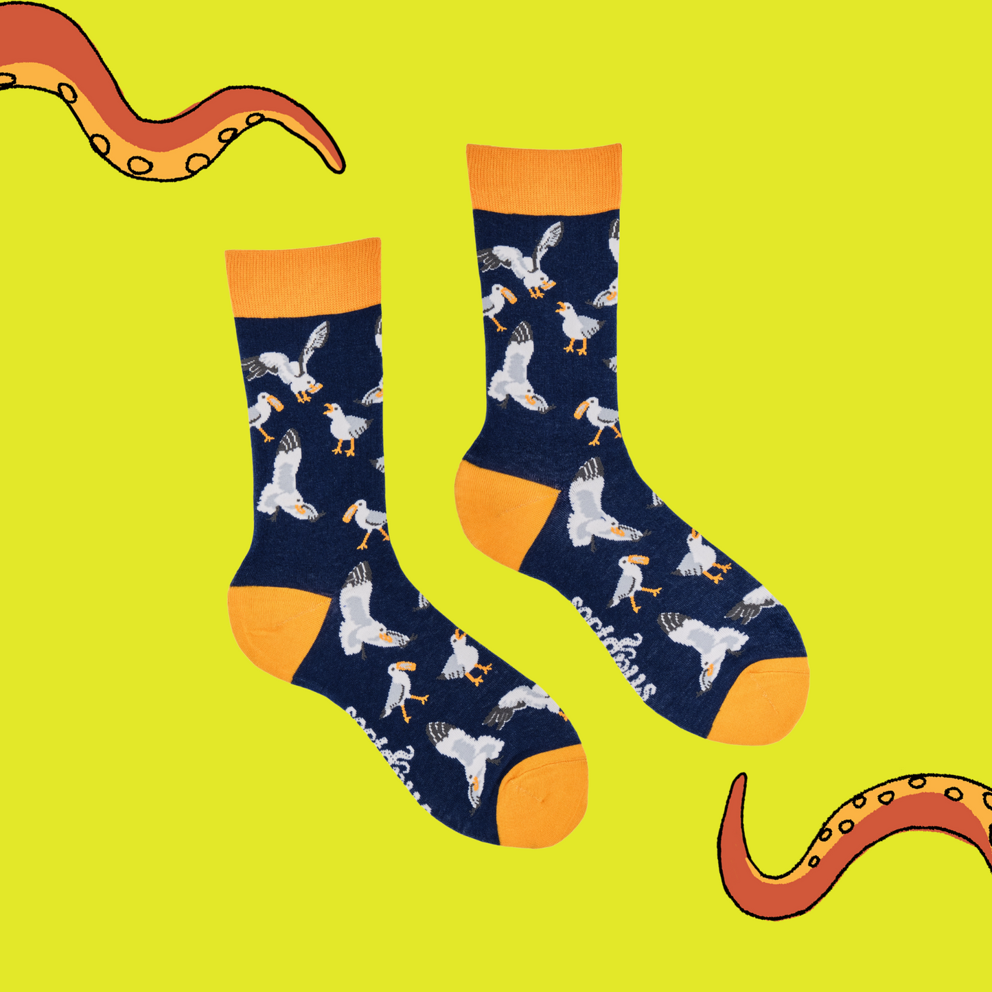 
                  
                    A pair of socks depicting seagulls eating chips. Blue legs, yellow cuff, heel and toe.
                  
                