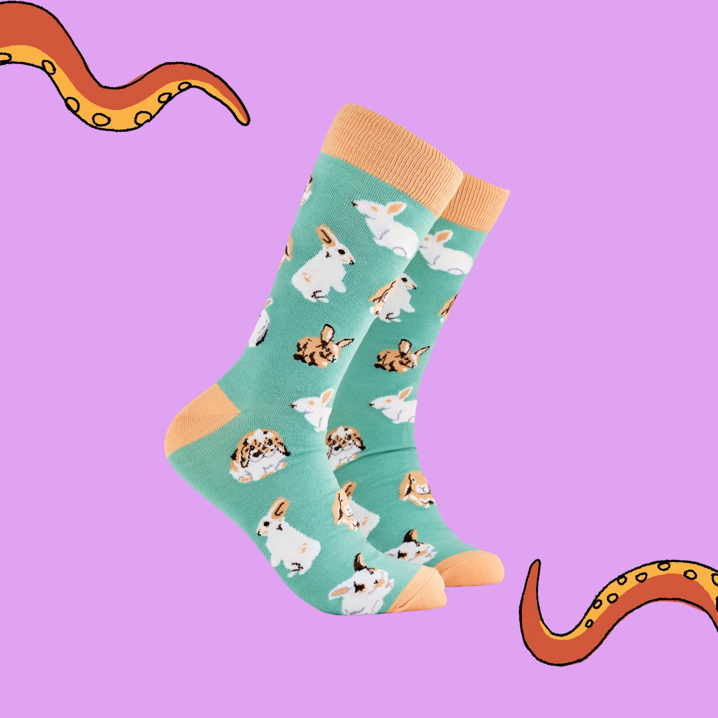 
                  
                    A pair of socks depicting rabbits playing. Green legs, brown cuff, heel and toe.
                  
                