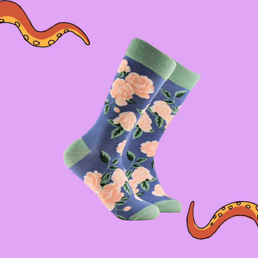 Rose Floral Bamboo Socks. A pair of socks depicting pink roses. Blue legs, green cuff, heel and toe.