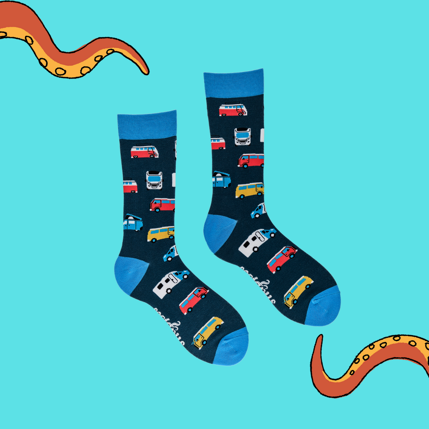 
                  
                    A pair of socks depicting campervans. Dark blue legs, light blue cuff, heel and toe.
                  
                