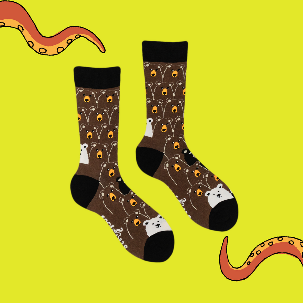 
                      
                        A pair of socks with a fun bear pattern. Brown legs, black heel, toe and cuff. 
                      
                    