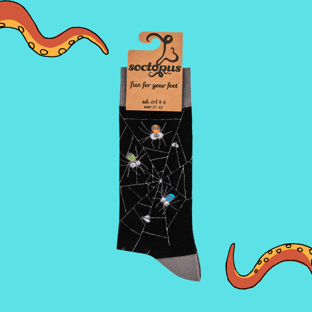 
                      
                        A pair of socks with googly eyed spiders. Black legs, grey heel, toe and cuff. 
                      
                    