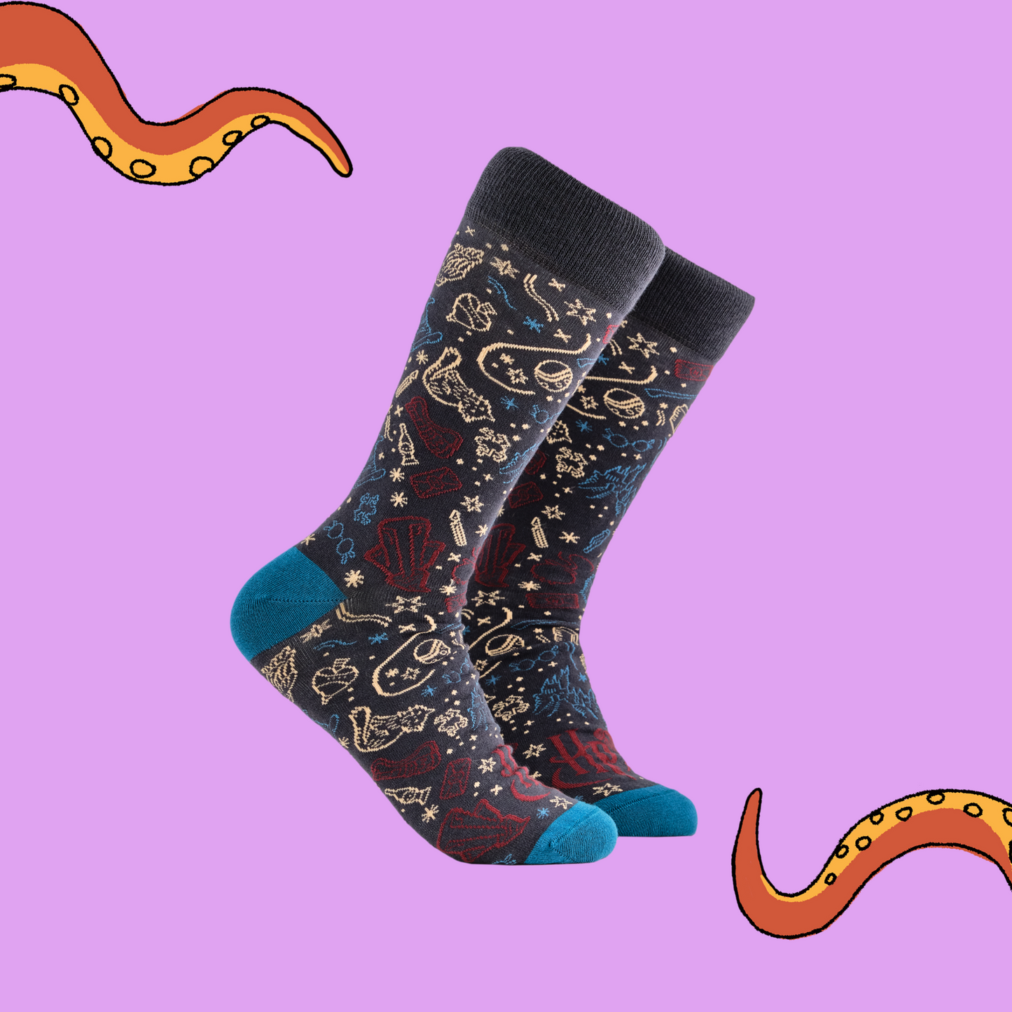 A pair of socks depicting lots of magical elements. Grey legs, blue cuff, heel and toe.