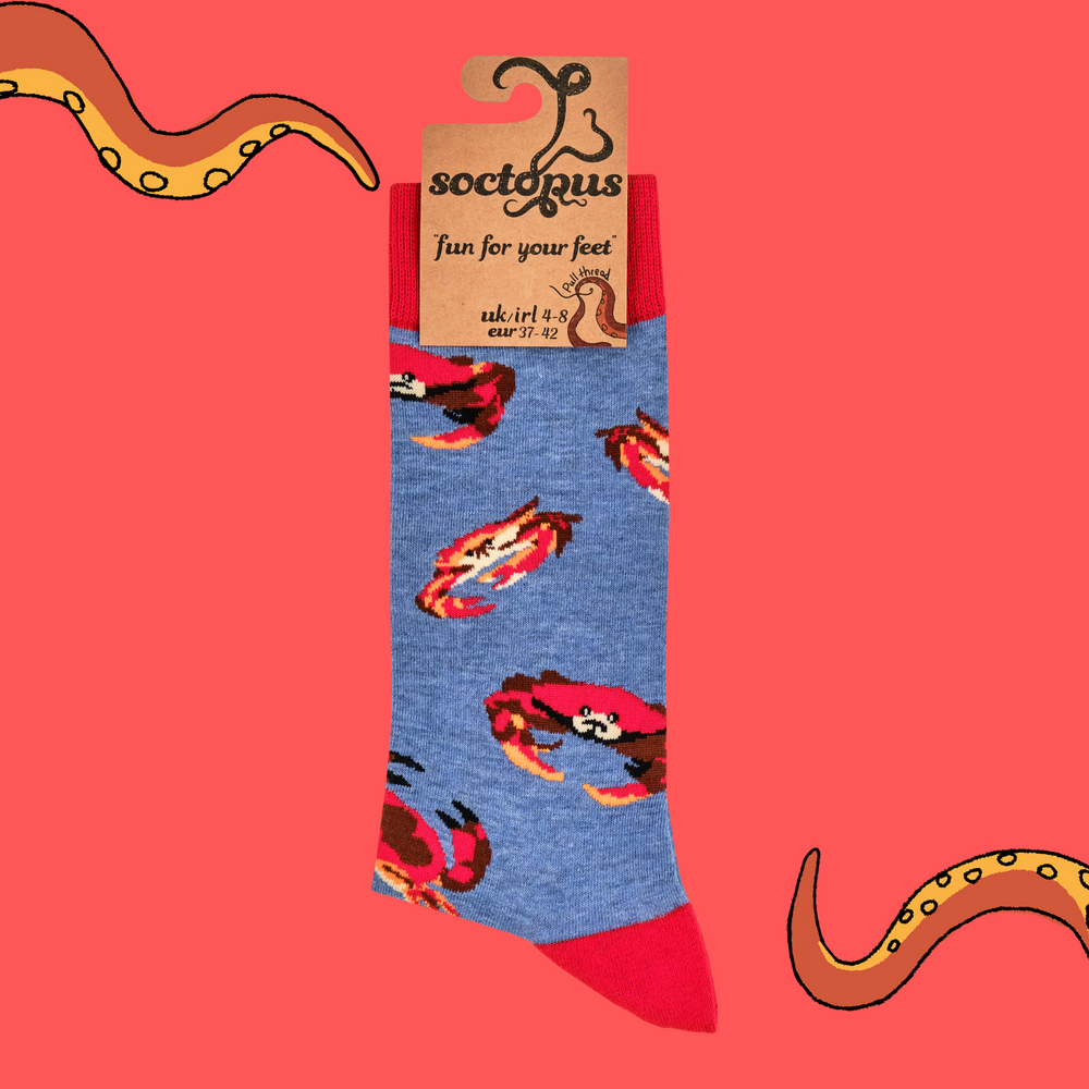 
                      
                        A pair of socks featuring a crab motif. Blue legs, red heel, toe and cuff. 
                      
                    