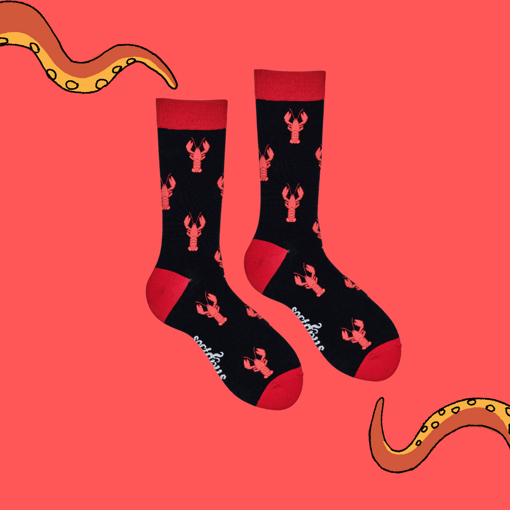 
                  
                    A pair of socks depicting red lobsters. Black legs, red cuff, heel and toe.
                  
                