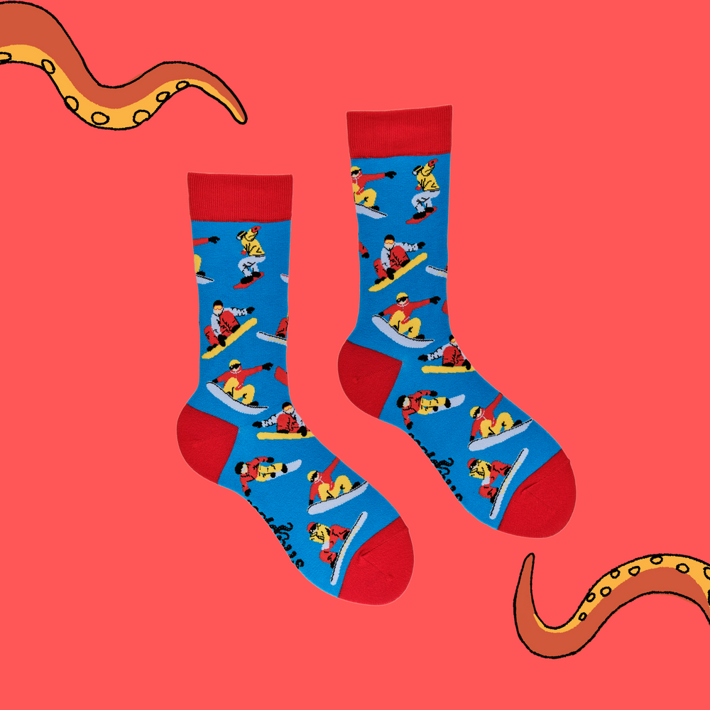
                  
                    A pair of socks depicting snowboarders. Blue legs, red cuff, heel and toe.
                  
                