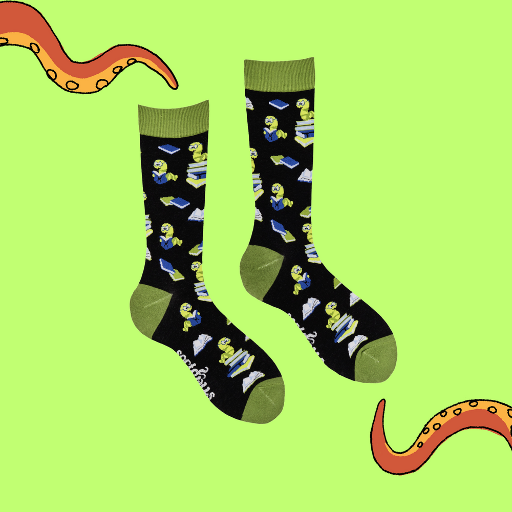 
                  
                    A pair of socks depicting worms reading books. Black legs, green cuff, heel and toe.
                  
                