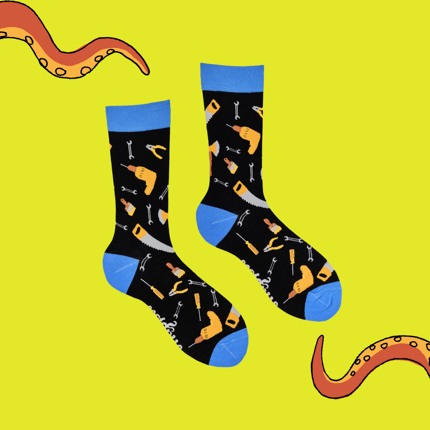 
                  
                    A pair of socks depicting DIY tools. Black legs, blue cuff, heel and toe.
                  
                