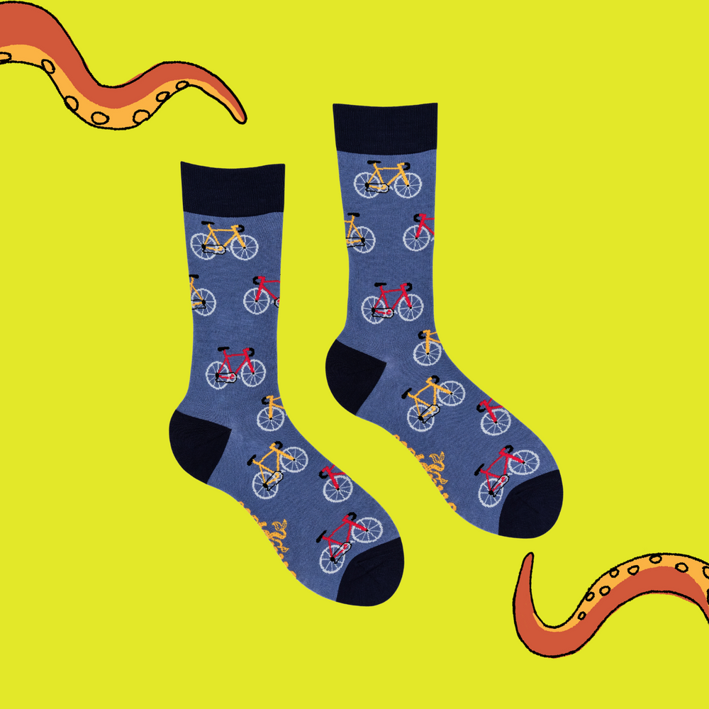 
                      
                        A pair of socks depicting red and yellow bikes. Blue legs, dark blue cuff, heel and toe.
                      
                    