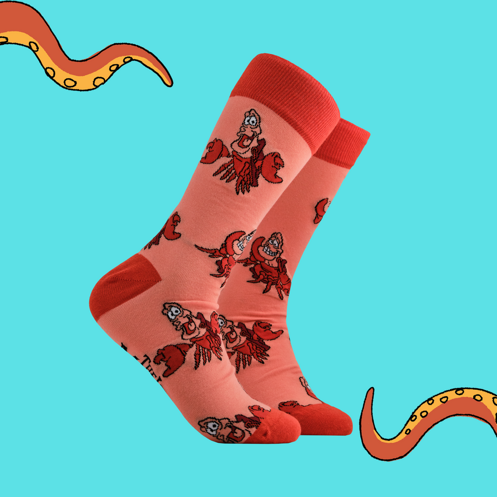 
                      
                        A pair of socks depicting Sebastian from The Little Mermaid. Coral legs, orange cuff, toe and heel.
                      
                    