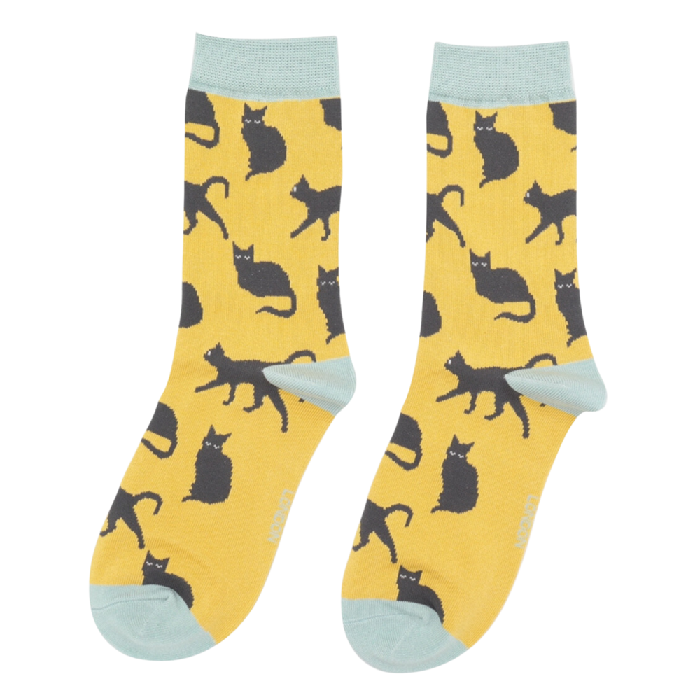 
                  
                    A pair of socks depicting cute black cats. Yellow legs, blue toe, cuff and heel.
                  
                