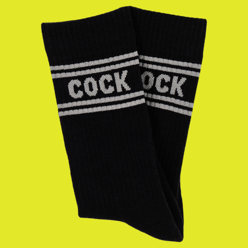 
                      
                        A black pair of athletic socks with white trim on the ankles and toes. A euphemism for the male genitals on the ankle.
                      
                    