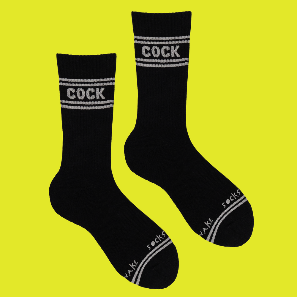 A black pair of athletic socks with white trim on the ankles and toes. A euphemism for the male genitals on the ankle. 