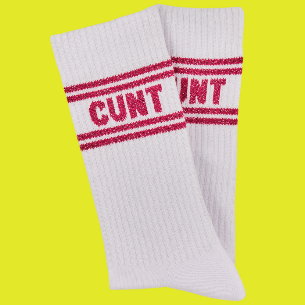 
                  
                    A white pair of athletic socks with red trim on the ankles and toes. A euphemism for the female genitals on the ankle.
                  
                