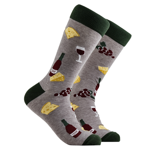 Charcuterie Socks - Cheese and Wine. A pair of socks depicting wine, cheese and grapes. Grey legs, green cuff, heel and toe.