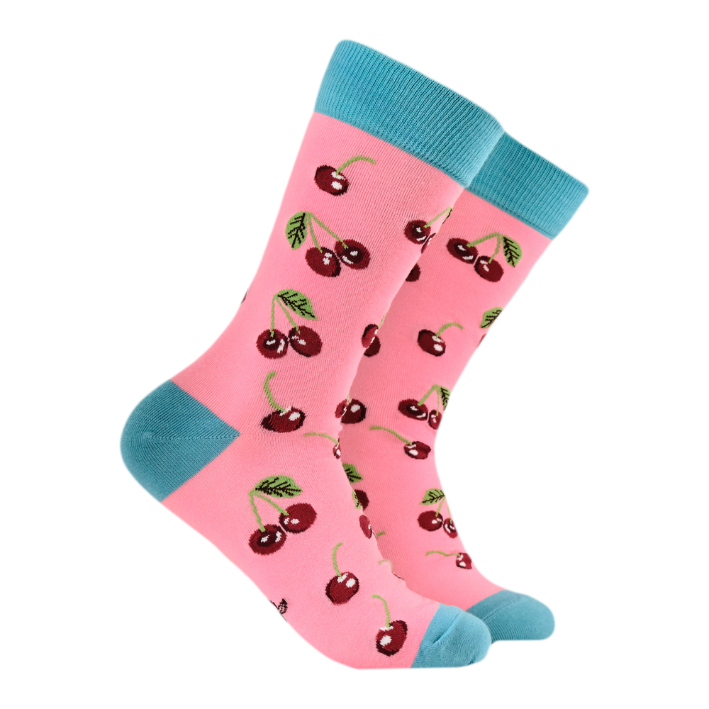 Cherries Bamboo Socks. A pair of socks featuring cherries. Pink legs, bright blue heel, toe and cuff. 