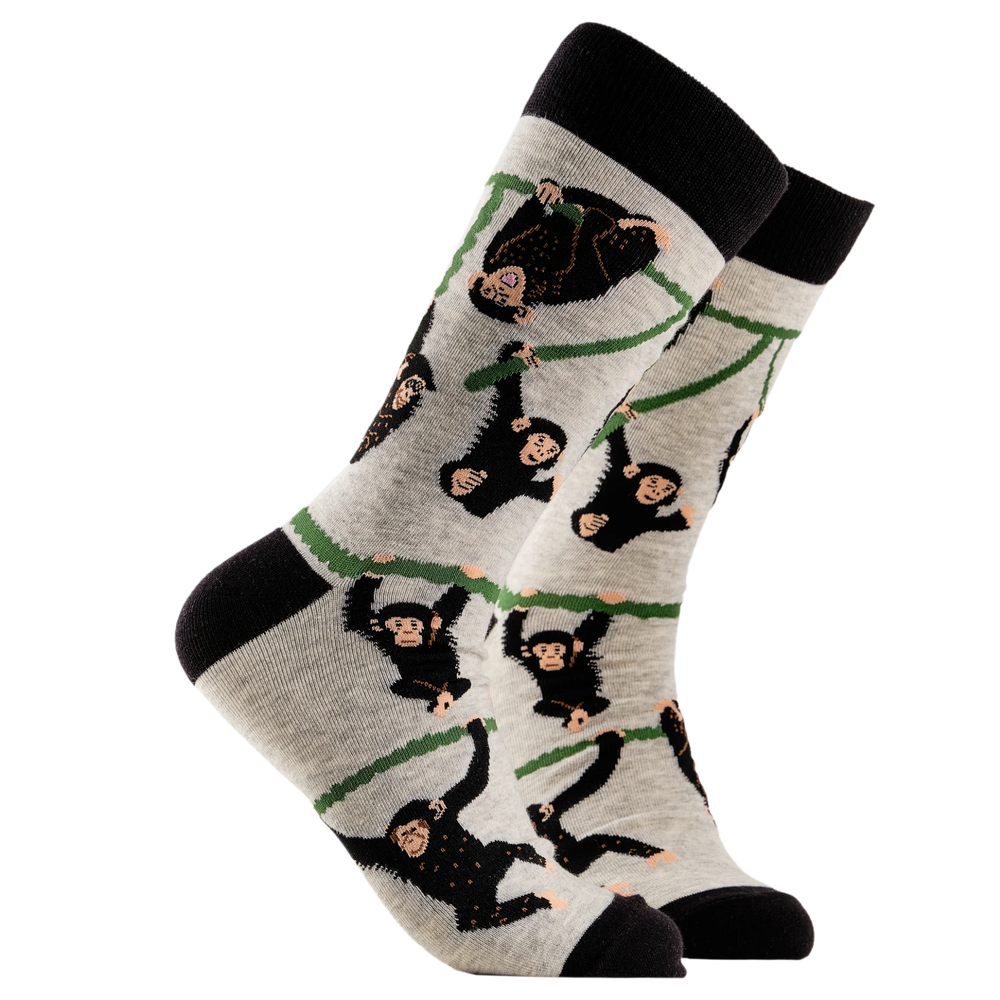 
                      
                        A pair of socks depicting playful chimpanzees. Grey legs, black cuff, heel and toe.
                      
                    