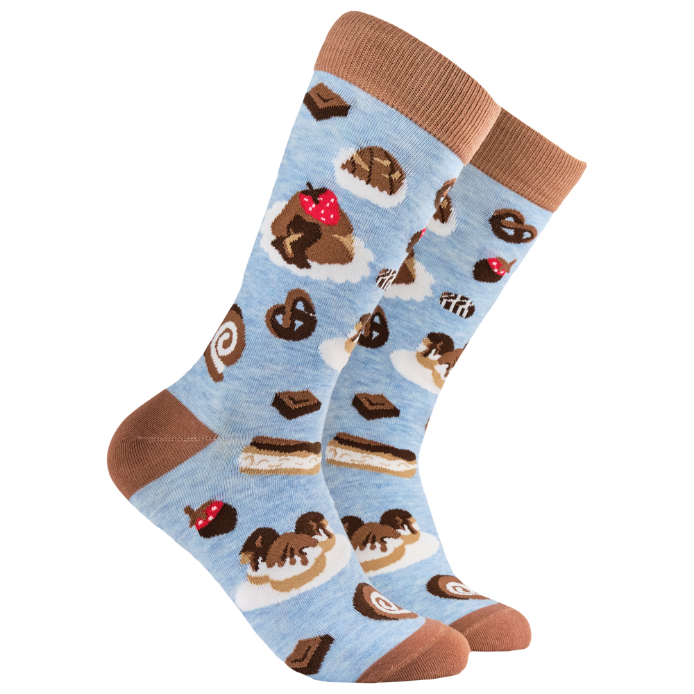 
                      
                        Chocolate Socks - Choc-Aholic. A pair of socks depicting cakes and chocolates. Blue legs, brown heel, toe and cuff. 
                      
                    