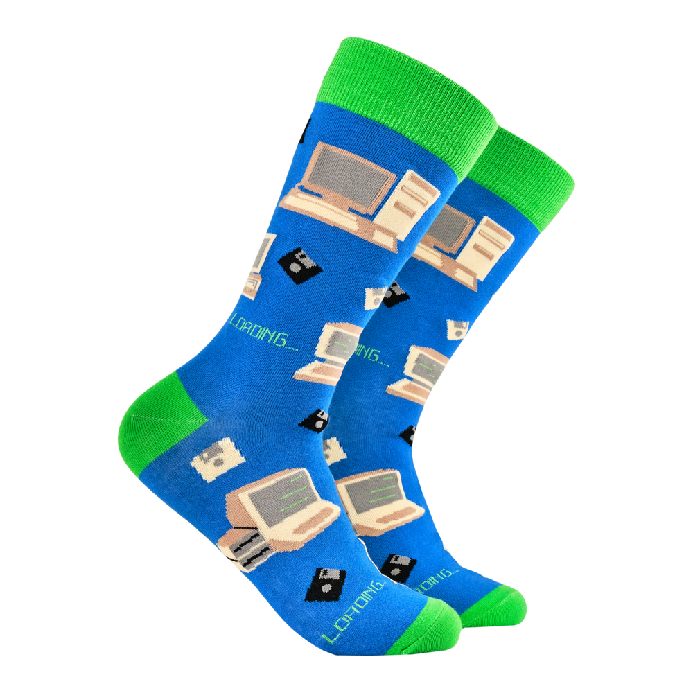 Computer Geek Socks. A pair of socks featuring old school computers and floppy disks. Blue legs, green heel, toe and cuff. 