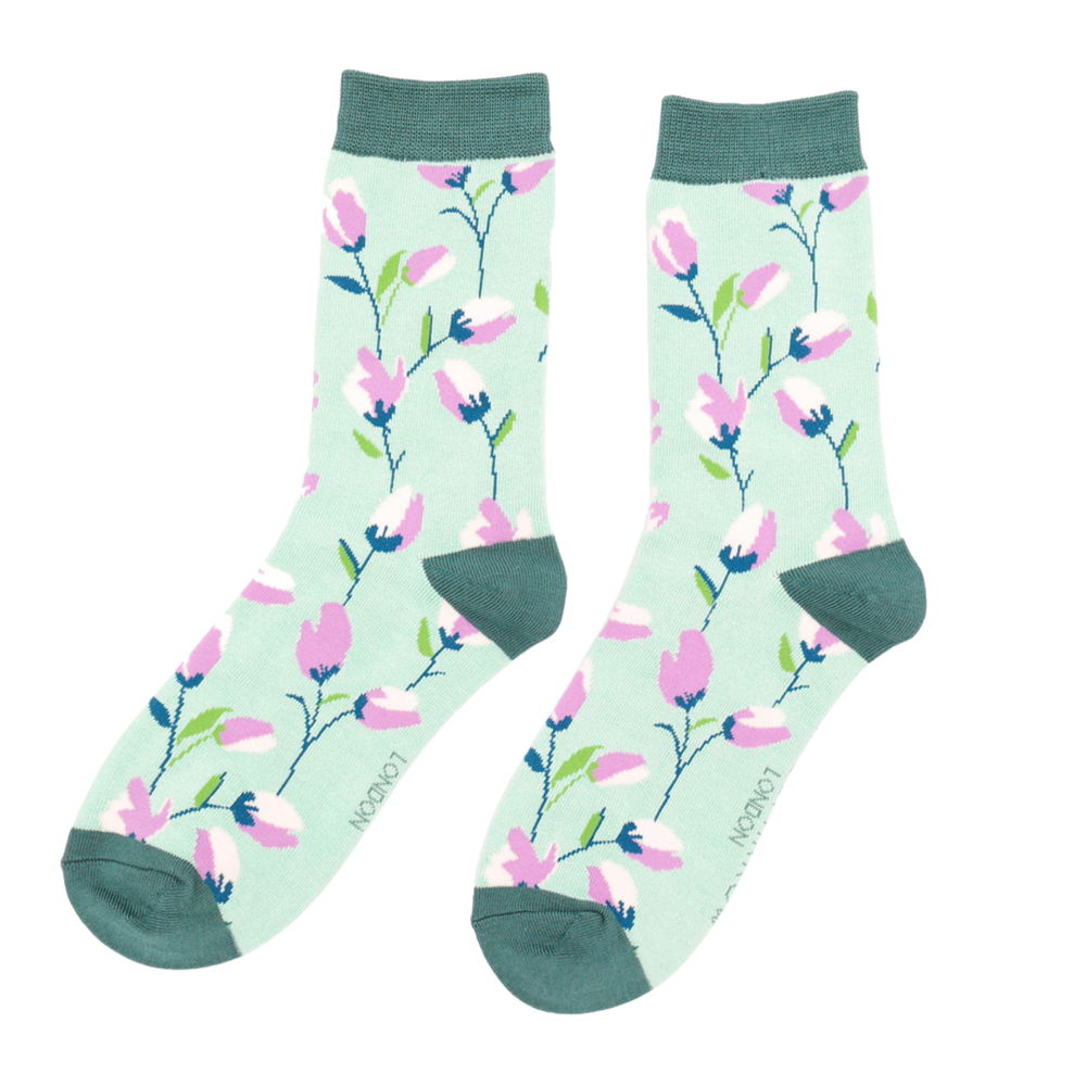 
                      
                        Ditsy Flowers Bamboo Socks - Miss Sparrow. A pair of socks with a fun floral pattern. Green legs, green cuff, heel and toe. 
                      
                    