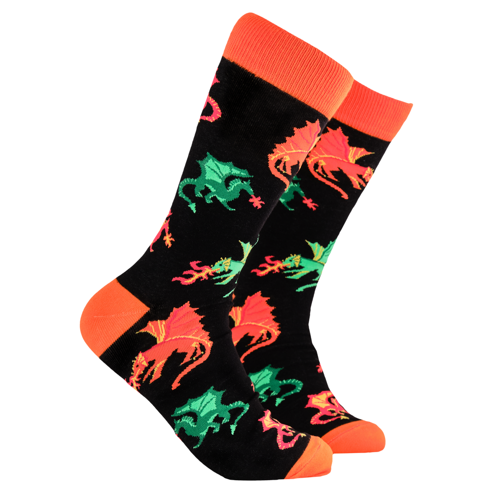 A pair of socks depicting fire breathing dragons. Black legs, orange cuff, heel and toe.