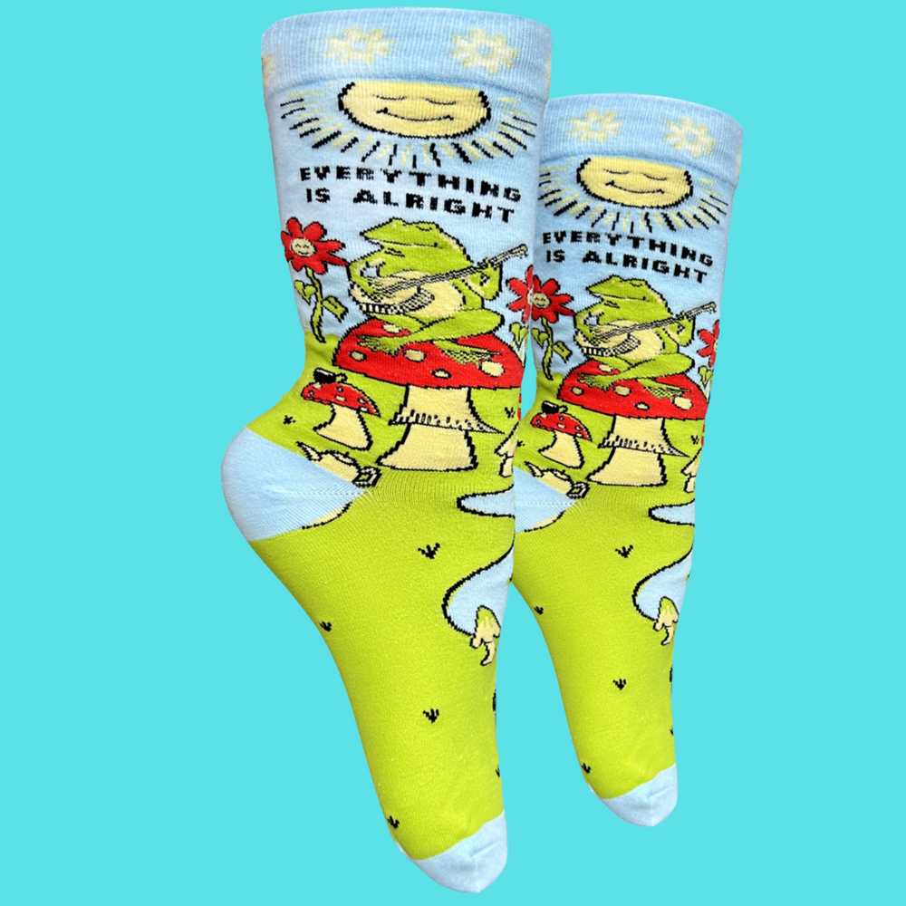 Everything Is Alright Socks. A pair of Socks depicting a blissed out frog sat on a magic mushroom. Bright blue toes, heels and cuffs.