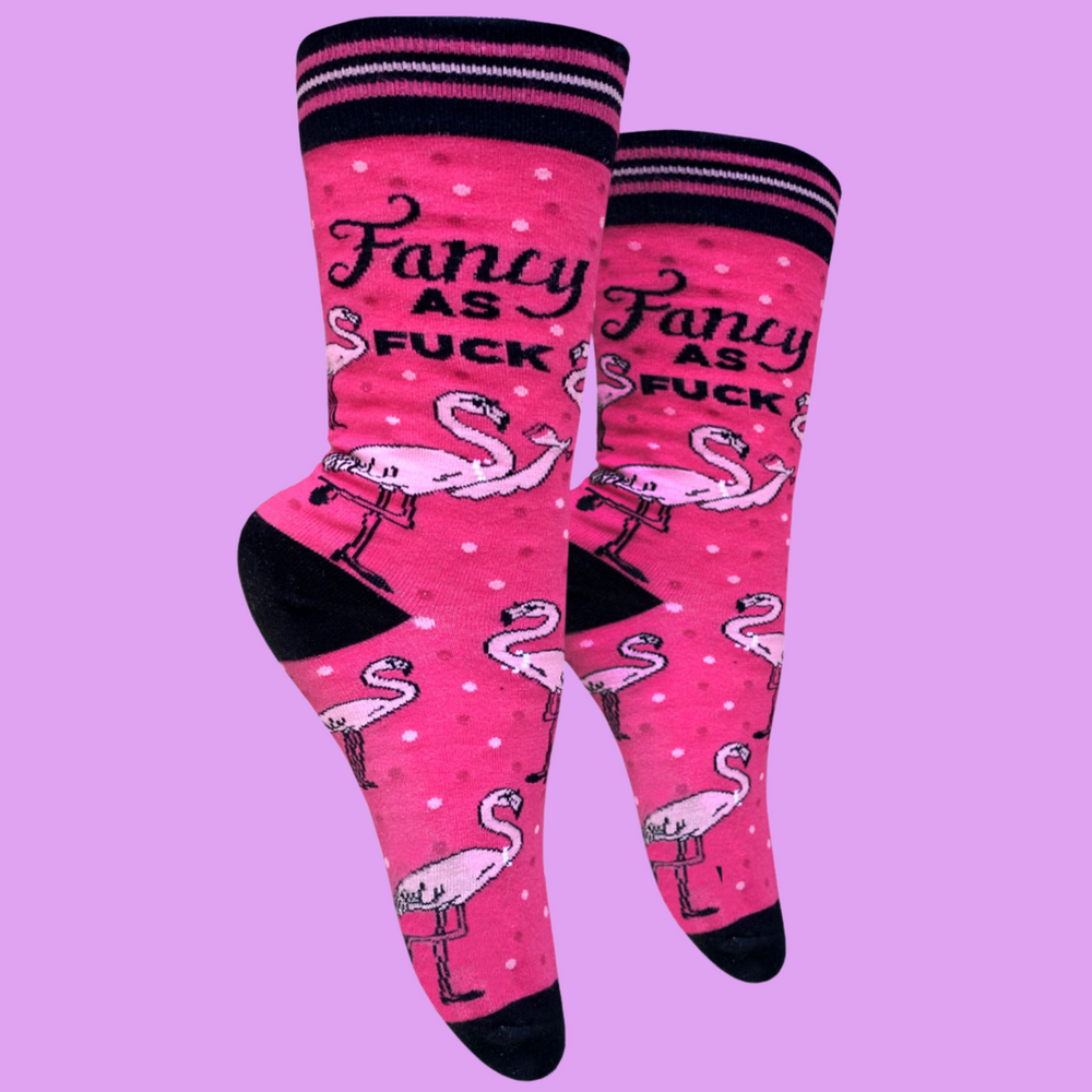 
                  
                    Fancy AF Socks. A pair of socks with a bold slogan and a flamingo motif. Bright pink legs, black toes, heels and cuffs.
                  
                