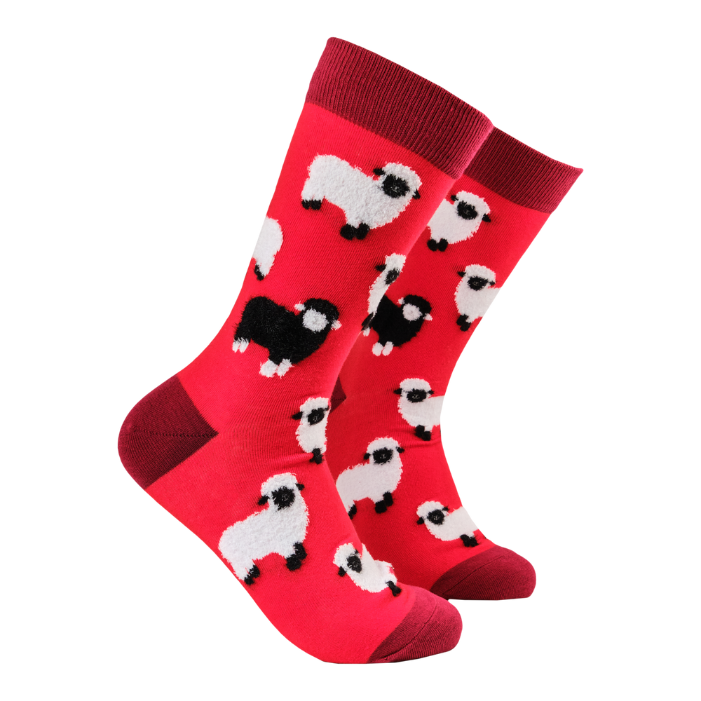 
                      
                        Fluffy Sheep Socks. A pair of socks featuring fluffy sheep. Red legs, red heel, toe and cuff. 
                      
                    