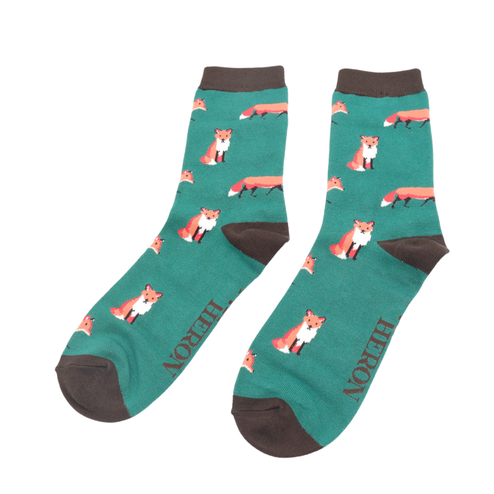 
                  
                    A pair of socks featuring a cute fox design. Green legs, grey cuff, heel and toe.
                  
                