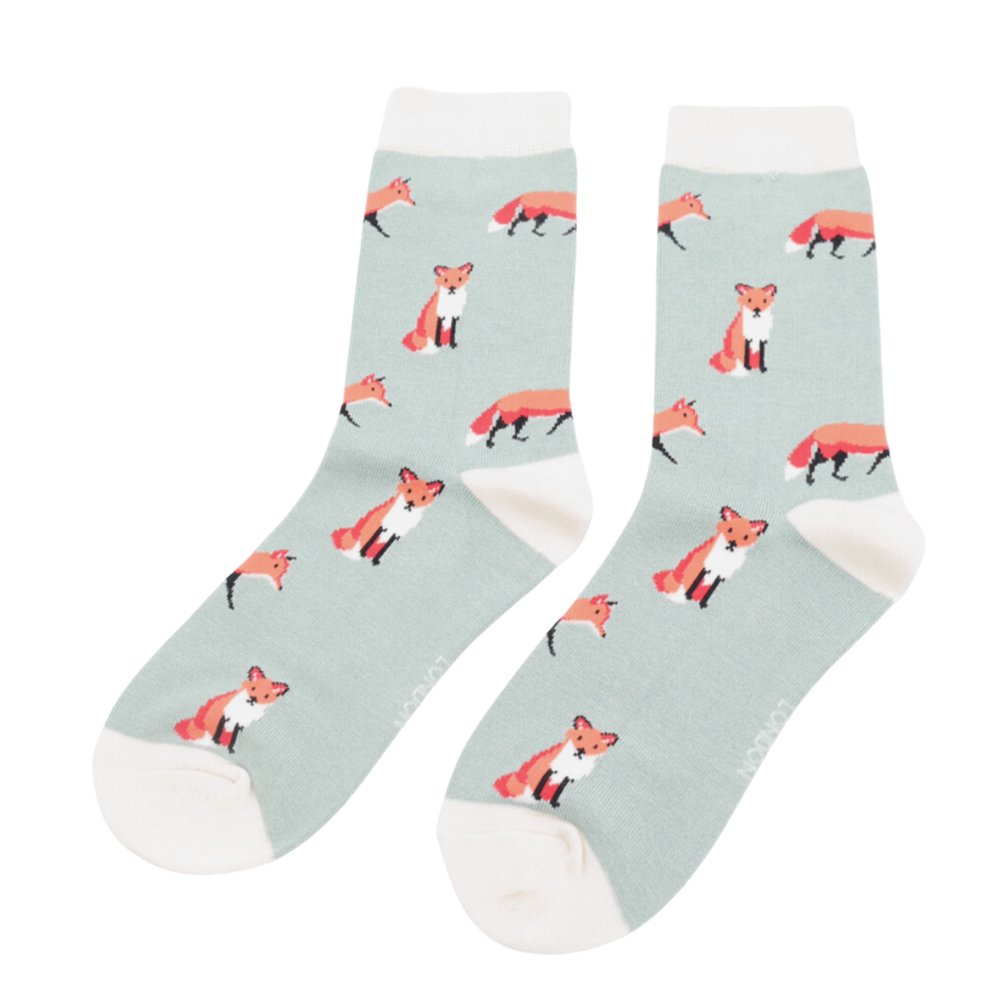 
                  
                    Foxes Bamboo Socks - Miss Sparrow. A pair of socks featuring a cute fox design. Light green legs, white cuff, heel and toe. 
                  
                