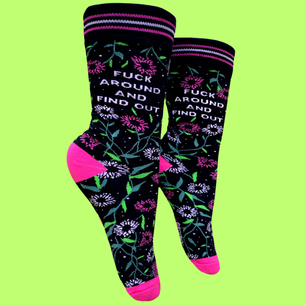 
                  
                    A pair of socks with a bold slogan and pink floral details. Pink toes, cuff and heel.
                  
                