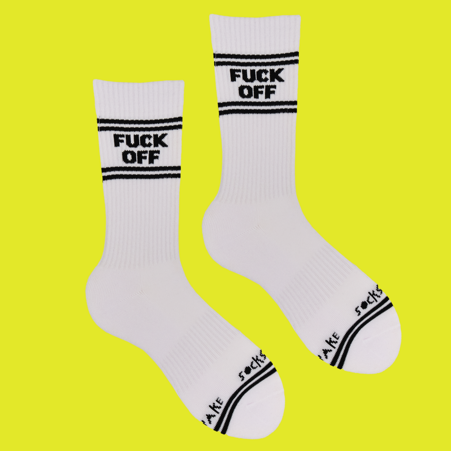 
                  
                    A white pair of athletic socks with black trim on the ankles and toes. And some very rude words that mean get lost on the ankle.
                  
                