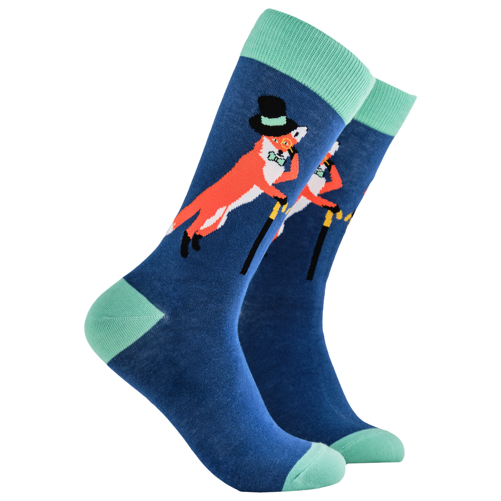 Fantastic Mr Fox Socks. A pair of socks depicting a fox in a top hat and monocle. Blue legs, green cuff, heel and toe.