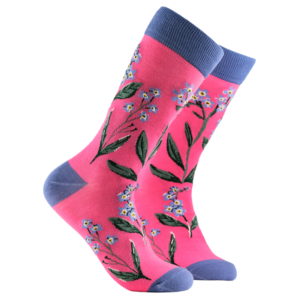 Forget Me Nots Floral Bamboo Socks. A pair of socks depicting forget me knot flowers. Pink legs, blue cuff, heel and toe.