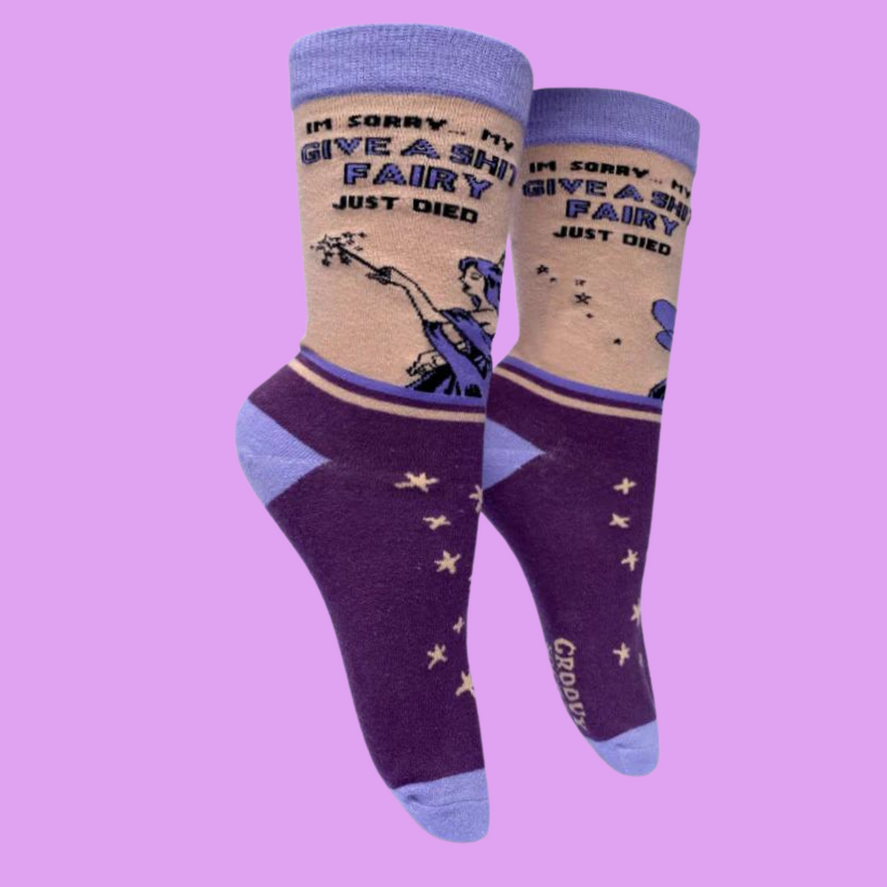 
                  
                    A pair of socks with a bold slogan and a fairy design. Purple feet and light purple toe, hell and cuff.
                  
                